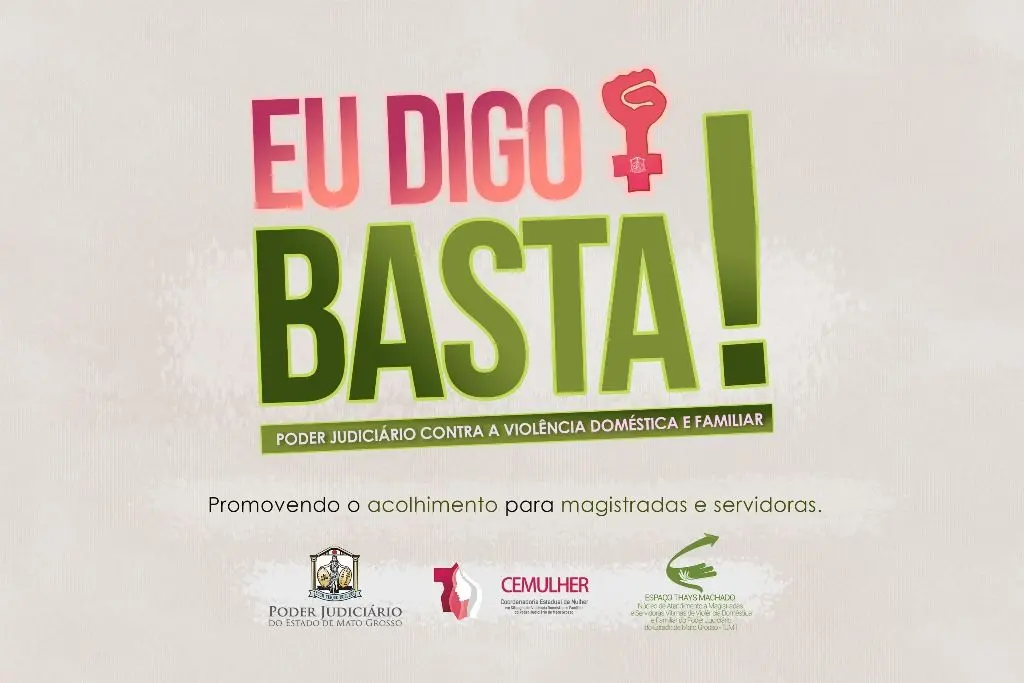 Imagem com fundo claro traz o slogan “Eu digo basta!” em destaque, com as palavras “Eu digo” em vermelho e “BASTA!” em verde. Acima da letra “A”, há o símbolo feminino com punho cerrado. Abaixo, a frase: “Poder Judiciário contra a violência doméstica e familiar”